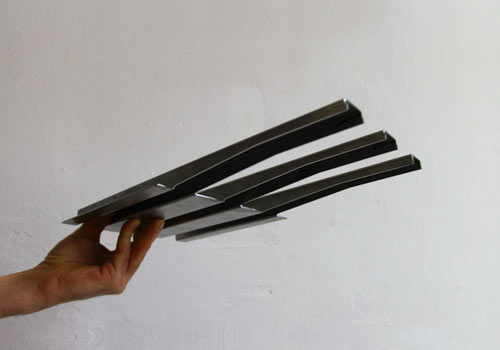 Custom detailed metal channel organizer for the inside of the Lictenstein table